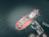 Fishing vessel with colorful deck in harbor