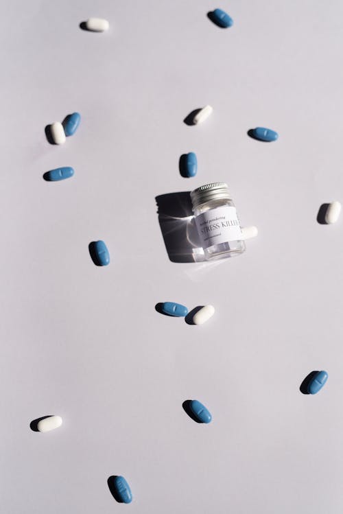 Free Close-Up Shot of Medicines on a White Surface Stock Photo