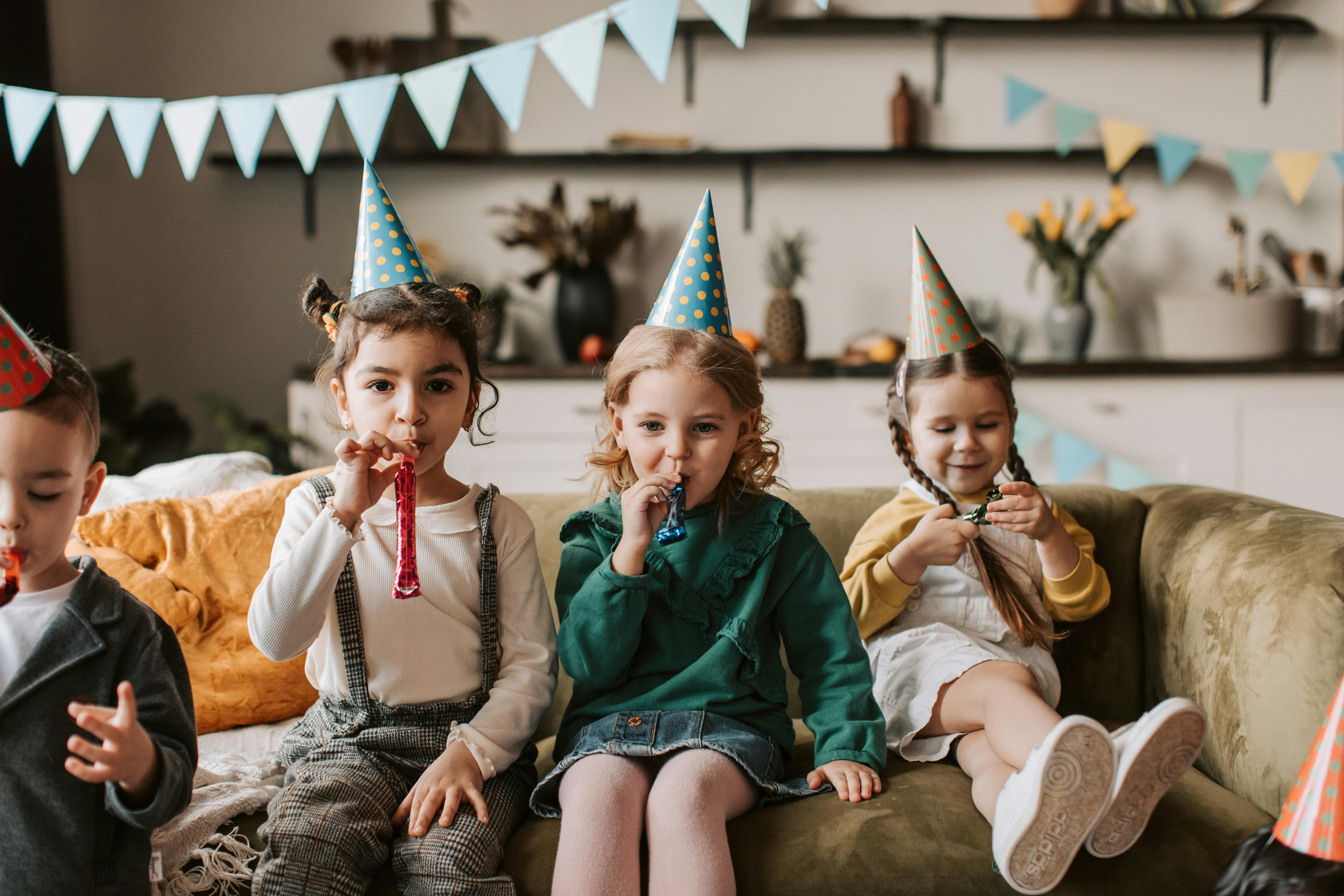 kids blowing party horns