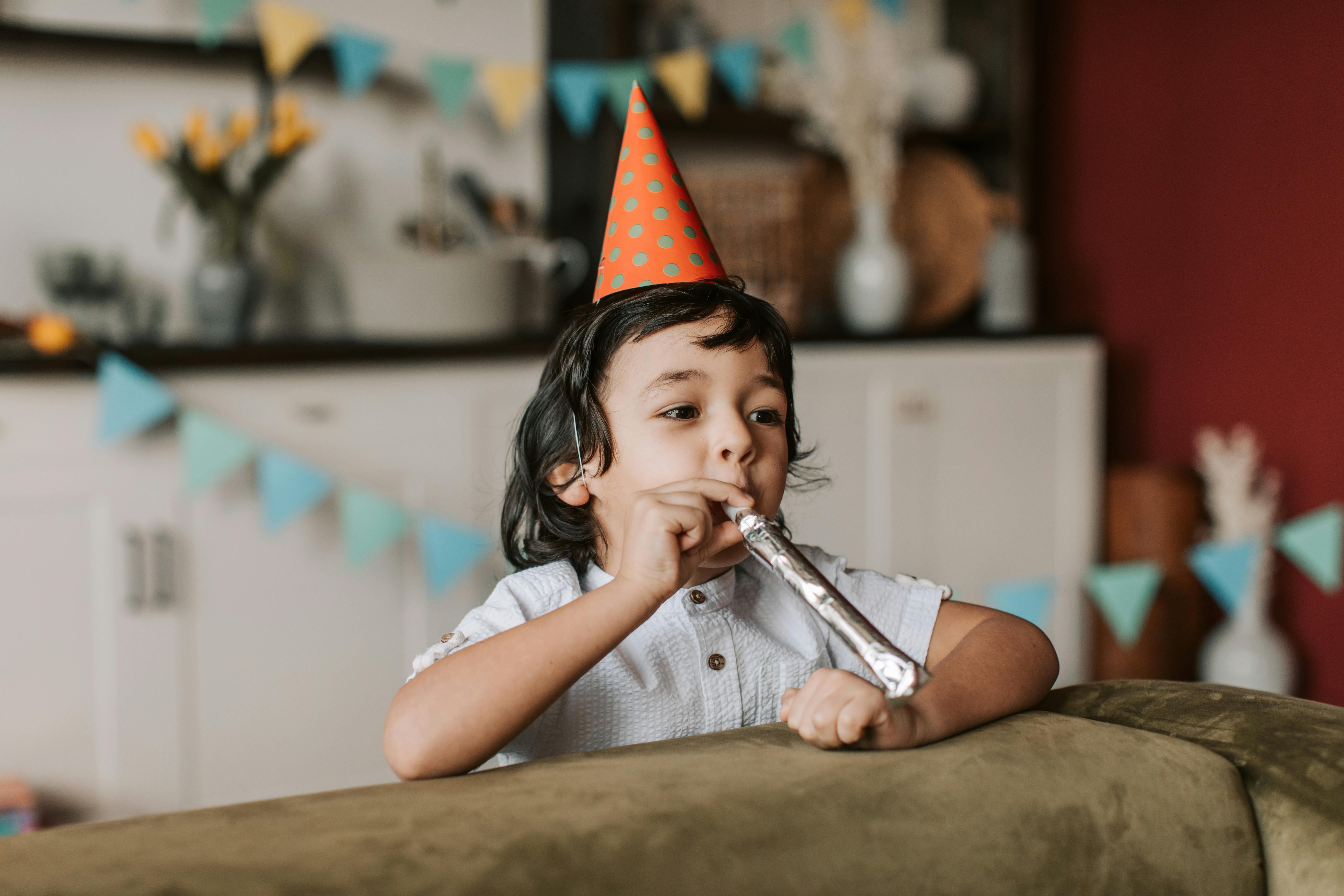 blowing birthday horn