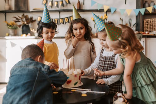 Free Photograph of Kids Eating a Cake Together Stock Photo