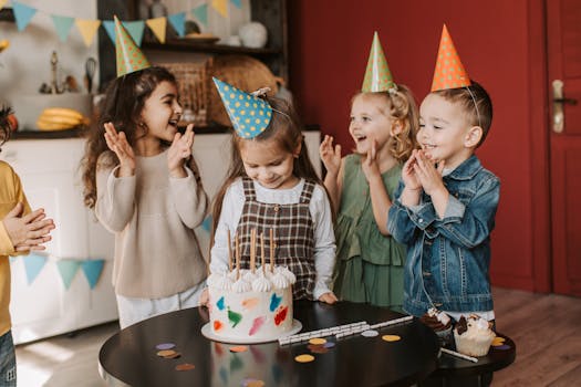 Happy kids celebrate with a colorful cake and party hats at a lively birthday party.