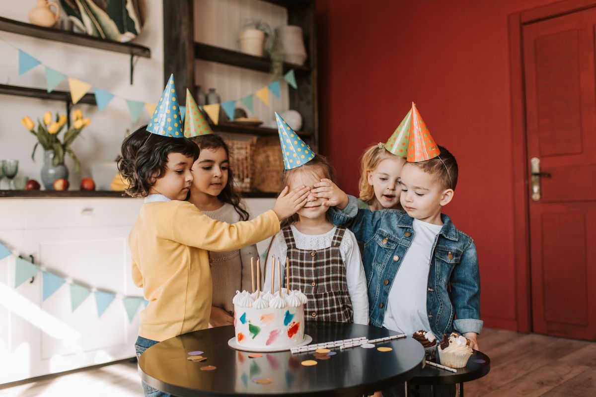 Kids making colorful party hats for New Year's Eve