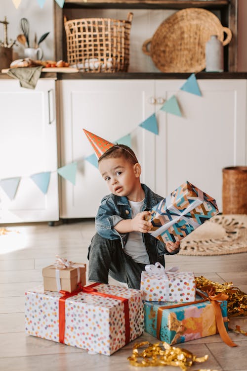 Free Boy Holding a Gift Stock Photo