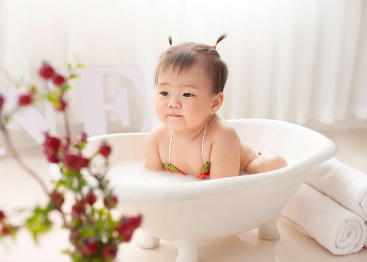 Cute Ethnic Baby In Bathtub