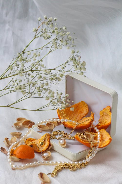 Free Orange Peels and a Necklace in a Box Stock Photo