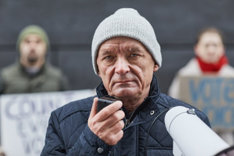 A Man Holding A Megaphone