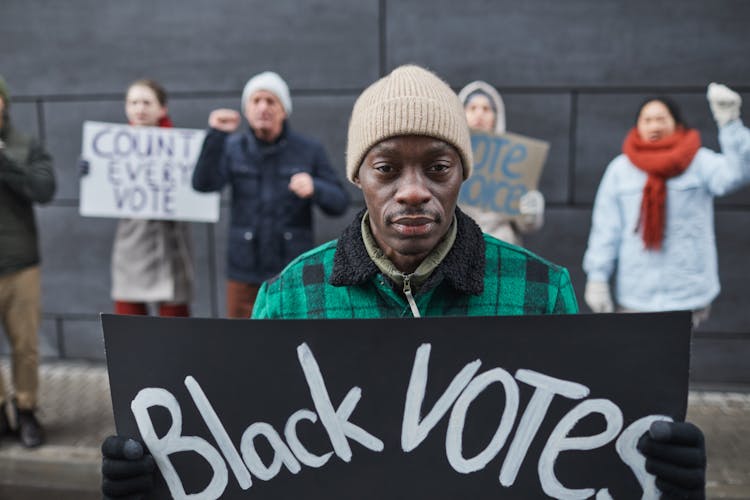 A Black Man Joining A Protest