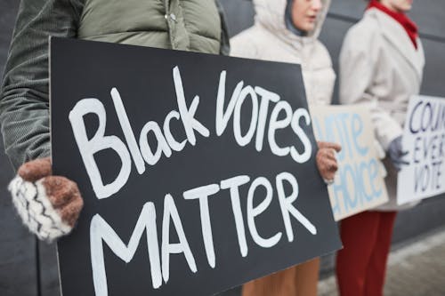 Free A Person Holding Black Votes Matter Placard Stock Photo