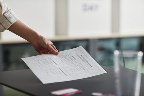 A Person Holding a Voting Ballot Paper