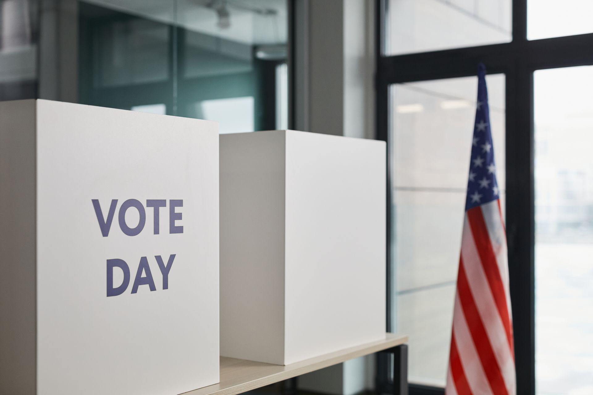 White Boxes on the Table Near American Flag