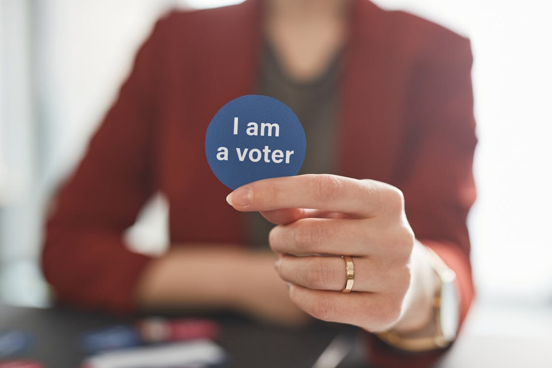 Free A Person Holding a I Am a Voter  Stock Photo