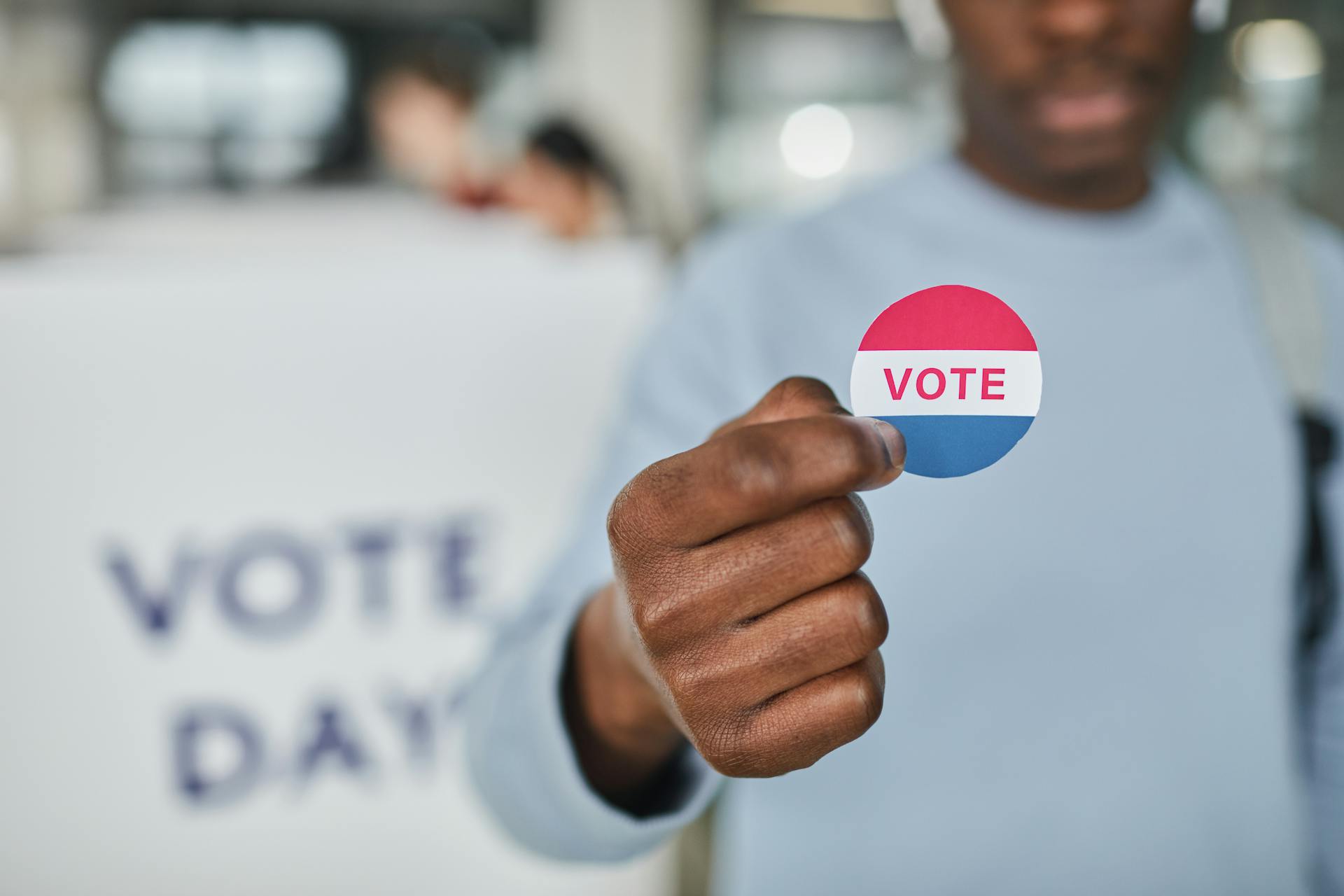 A Person Holding a Badge