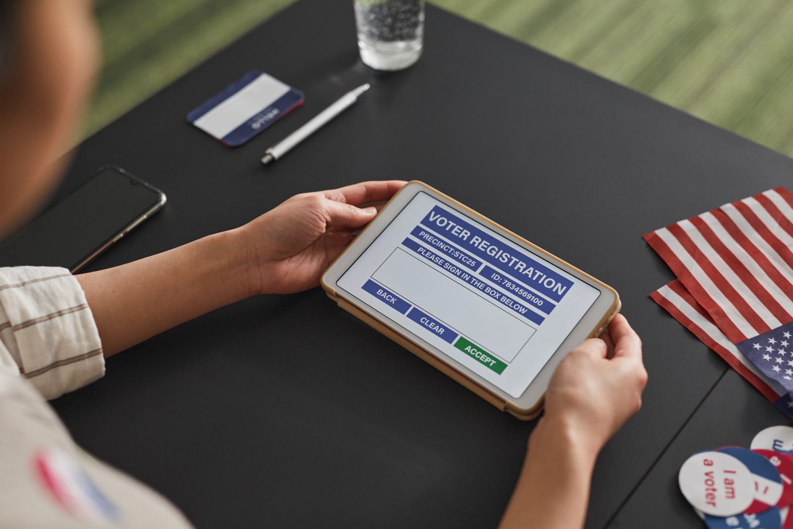 Business owner completing an online registration on a tablet