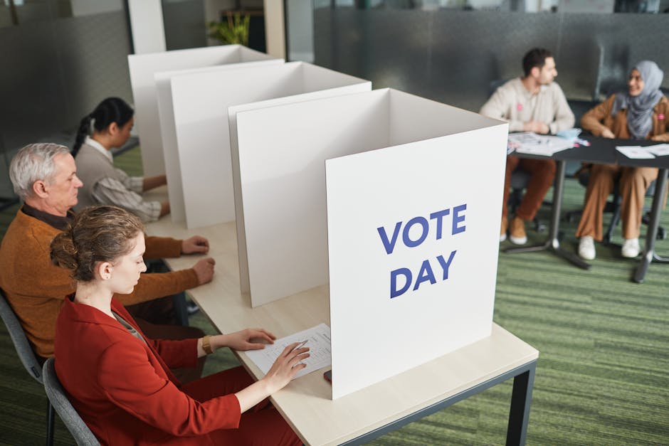 Photo by Edmond Dantès People casting votes in a polling station on election day, emphasizing civic engagement.