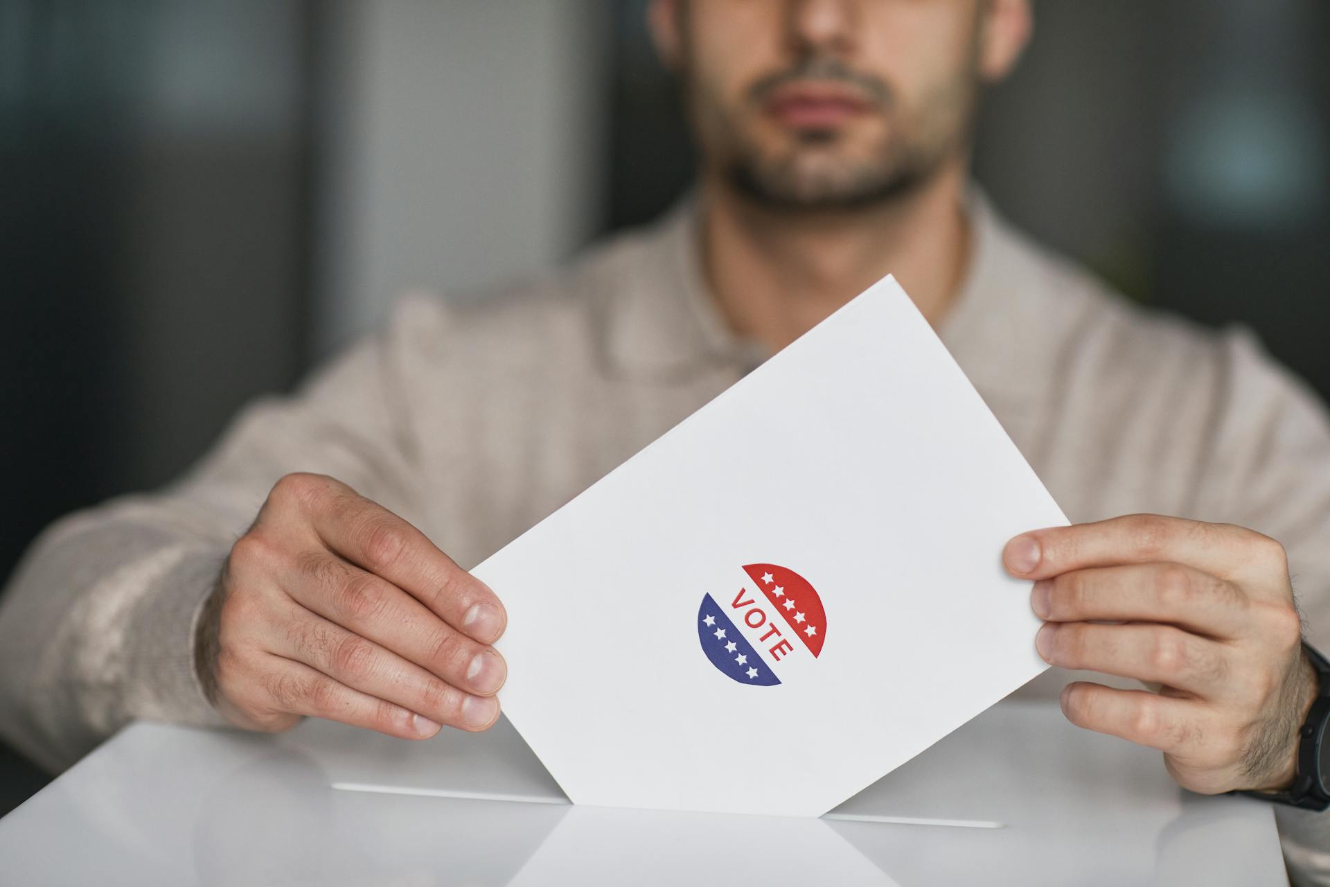 Man Holding Vote in Hands