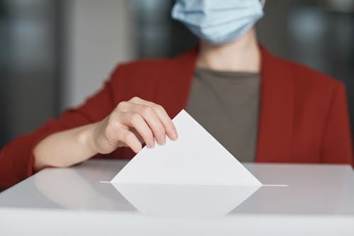 Ballot Box  with Person Casting a Vote