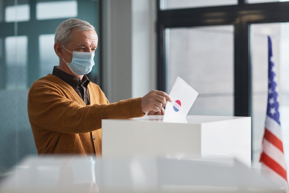 An Elderly Man Dropping a Paper in a Ballot Box