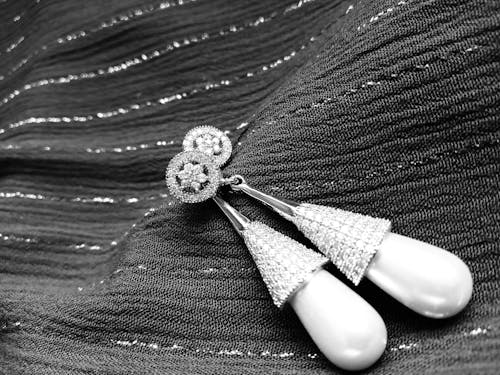 Grayscale Photo of Earrings