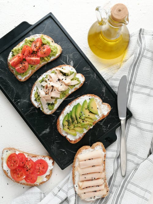 Free Variety of Bread Toast with Delicious Toppings  Stock Photo