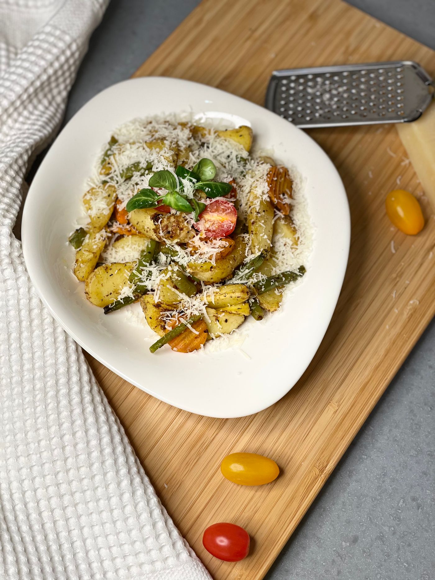 Gnocchi with vegetables and parmesan on a plate