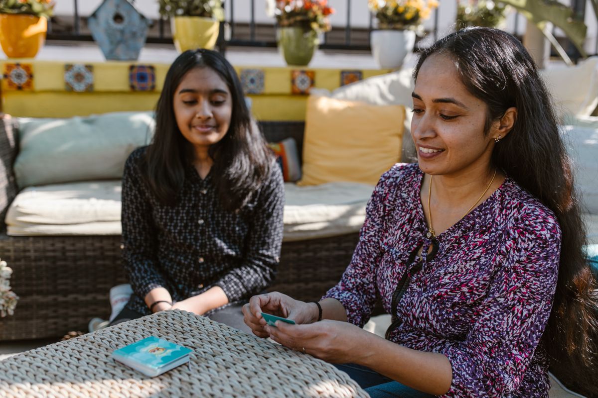 Indian mother and child participating in a communication and learning activity