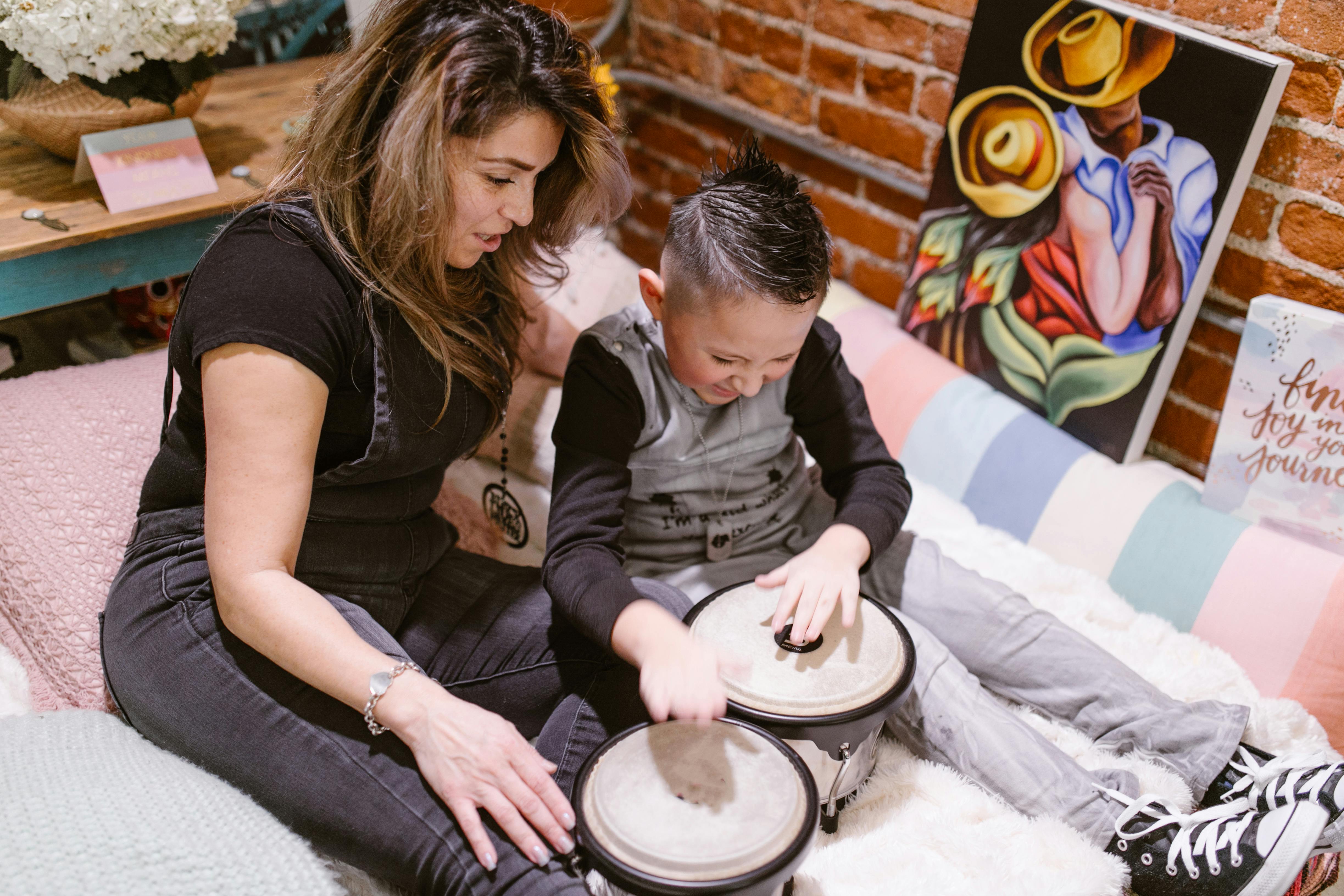 a young boy playing drums