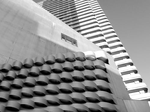 Black and white of geometric buildings on city street