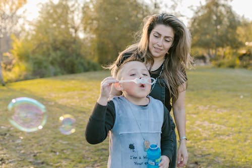 Free A Young Boy Playing Bubbles Stock Photo