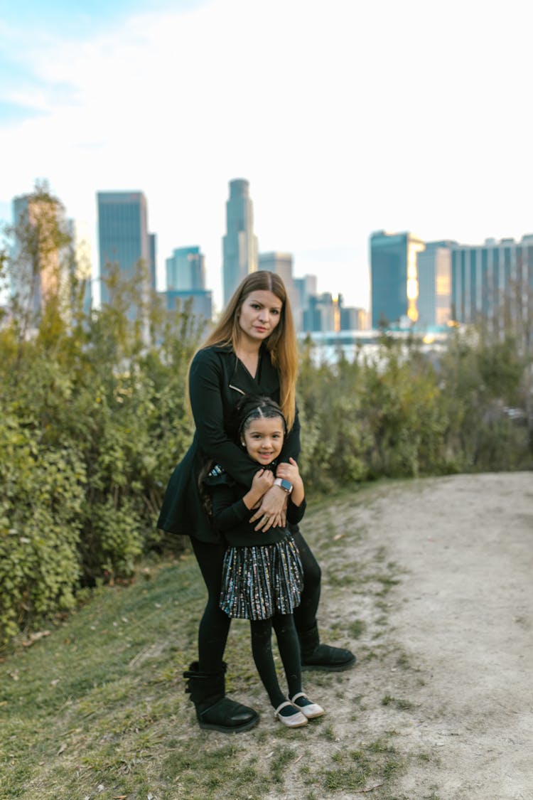 A Woman With Her Daughter At A Park