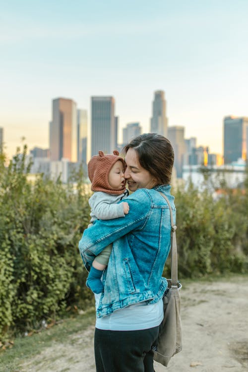 Free A Woman Carrying a Baby Stock Photo