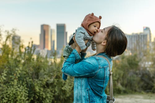 A Woman Carrying a Baby