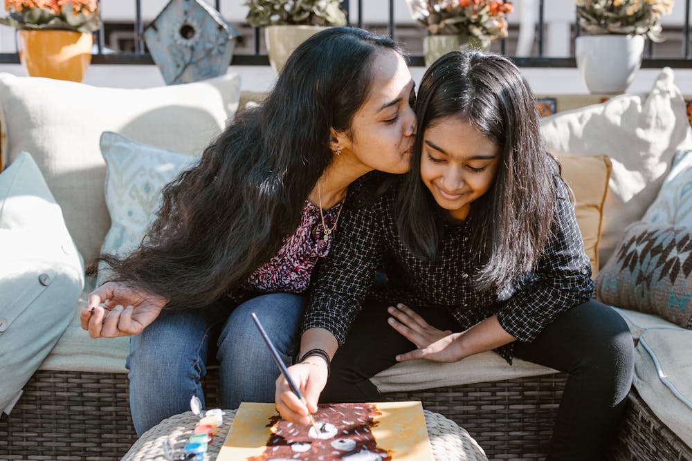 Mother Kissing Daughter Photo by RODNAE Productions from Pexels