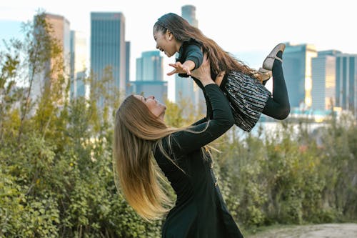 Mother Carrying Her Daughter