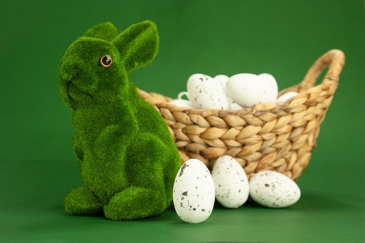 Green Rabbit Plush Toy Beside White Eggs