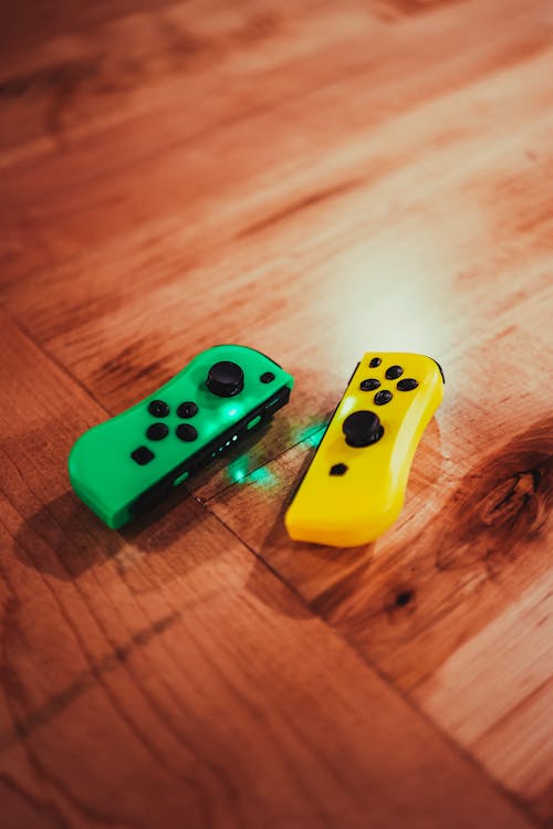 Free From above of pair of gamepads for playing video games in free time Stock Photo
