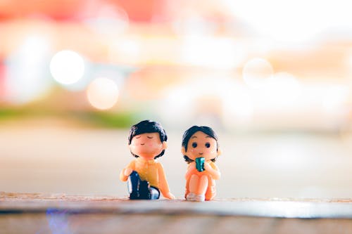 Cute figurines on illuminated street