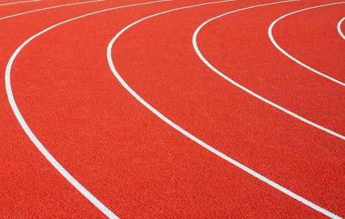 Close-up of Red and White Track Field