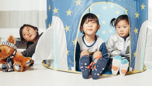 Free Group of Children Inside a Tent Stock Photo
