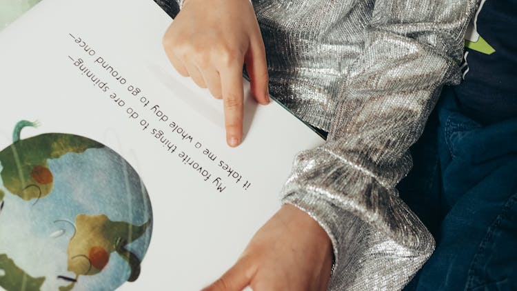 Child Reading A Book