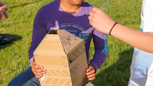 Boys Making a Cardboard Rocket