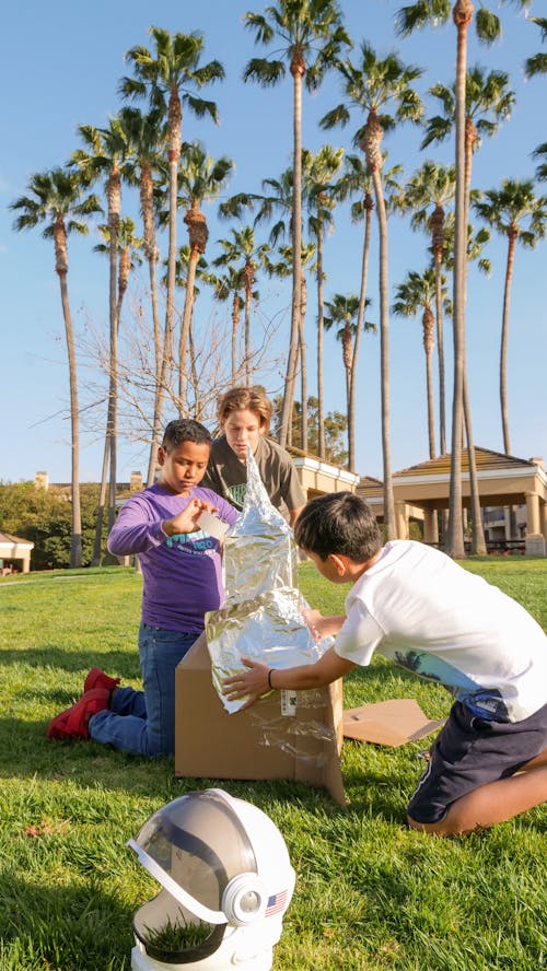 Boys Making a Cardboard Rocket