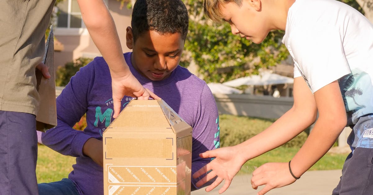 Children playing with a cardboard rocket in a sunny park, fostering teamwork and creativity.