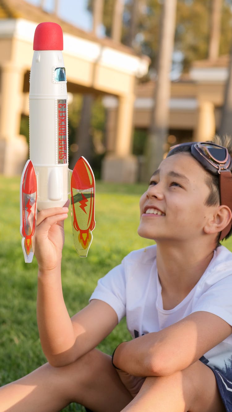 A Boy Playing A Rocket