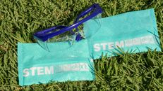 Protective Goggles and Stem Packaging on Green Grass