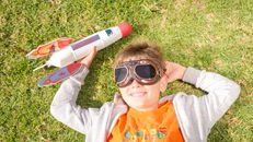 Boy in Gray and Orange Hoodie Wearing Black Sunglasses