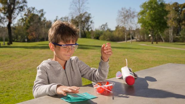 Boy in Gray Sweater and Safety Glasses 