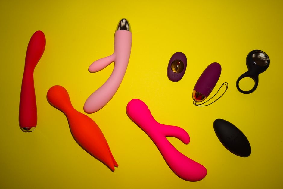 Flat-lay of premium clitoral vibrators, glass toys, and organic lubricants Flat-lay of premium clitoral vibrators, glass toys, and organic lubricants