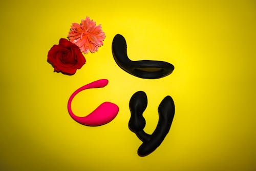 Flowers Petals and Accessories on Yellow Background