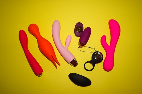 Free Kostenloses Stock Foto zu erotisch, gelbem hintergrund, sex-spielzeug Stock Photo